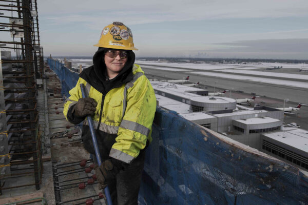Female union laborer during airport construction
