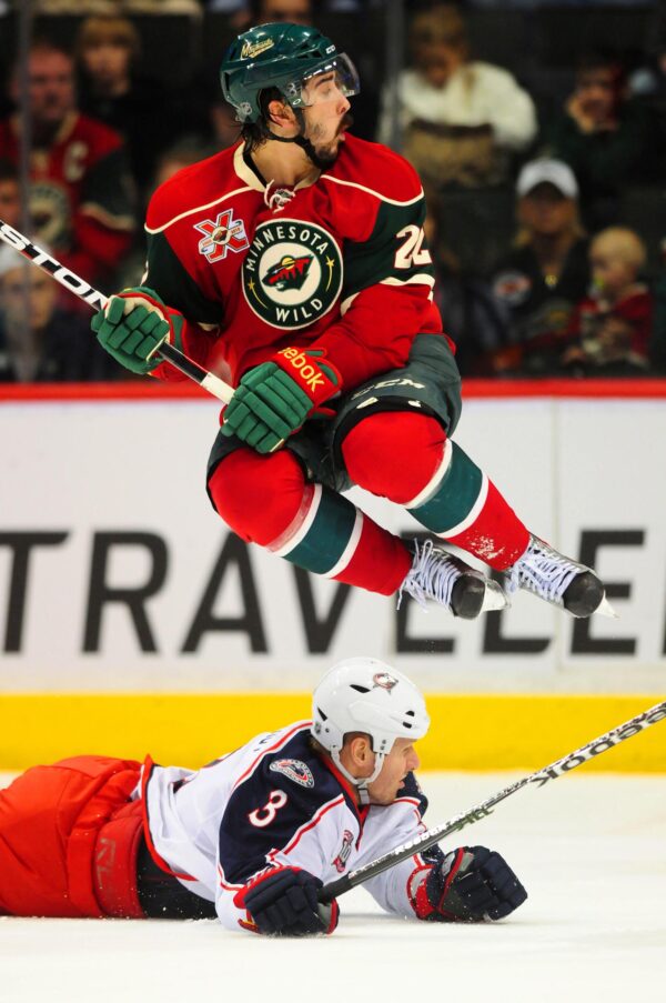 NHL player Cal Clutterbuck jumps out of the way