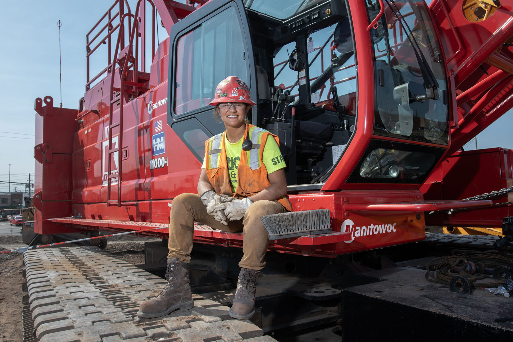 Woman operating engineer sitting on Manitowoc Crane.