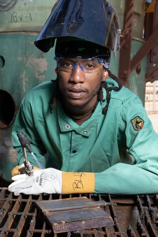 Afro American boilermaker welding