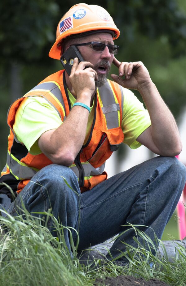 Construction worker on his cell phone