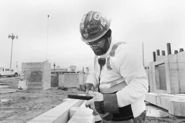 Laborer construction worker using an iPad