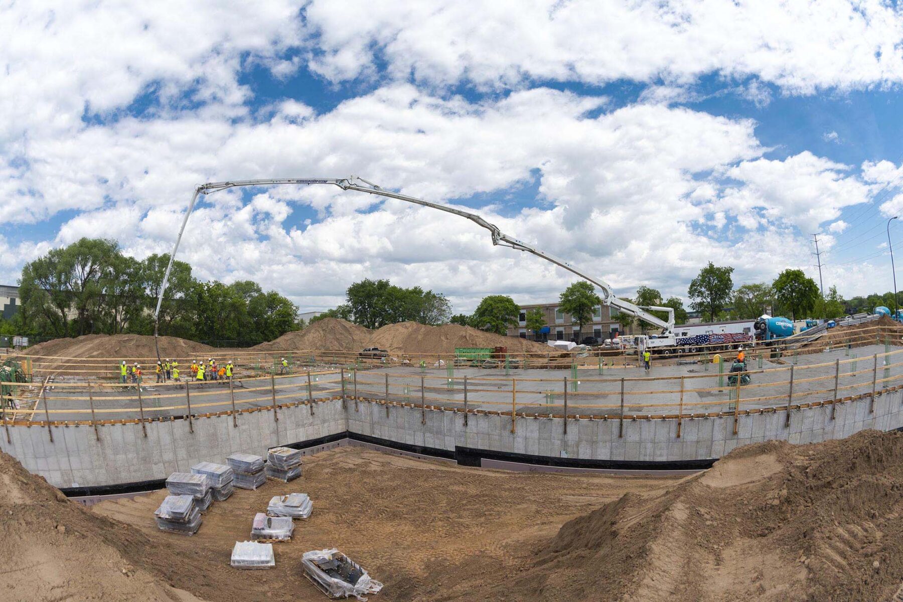 cement pouring at an apartment construction site