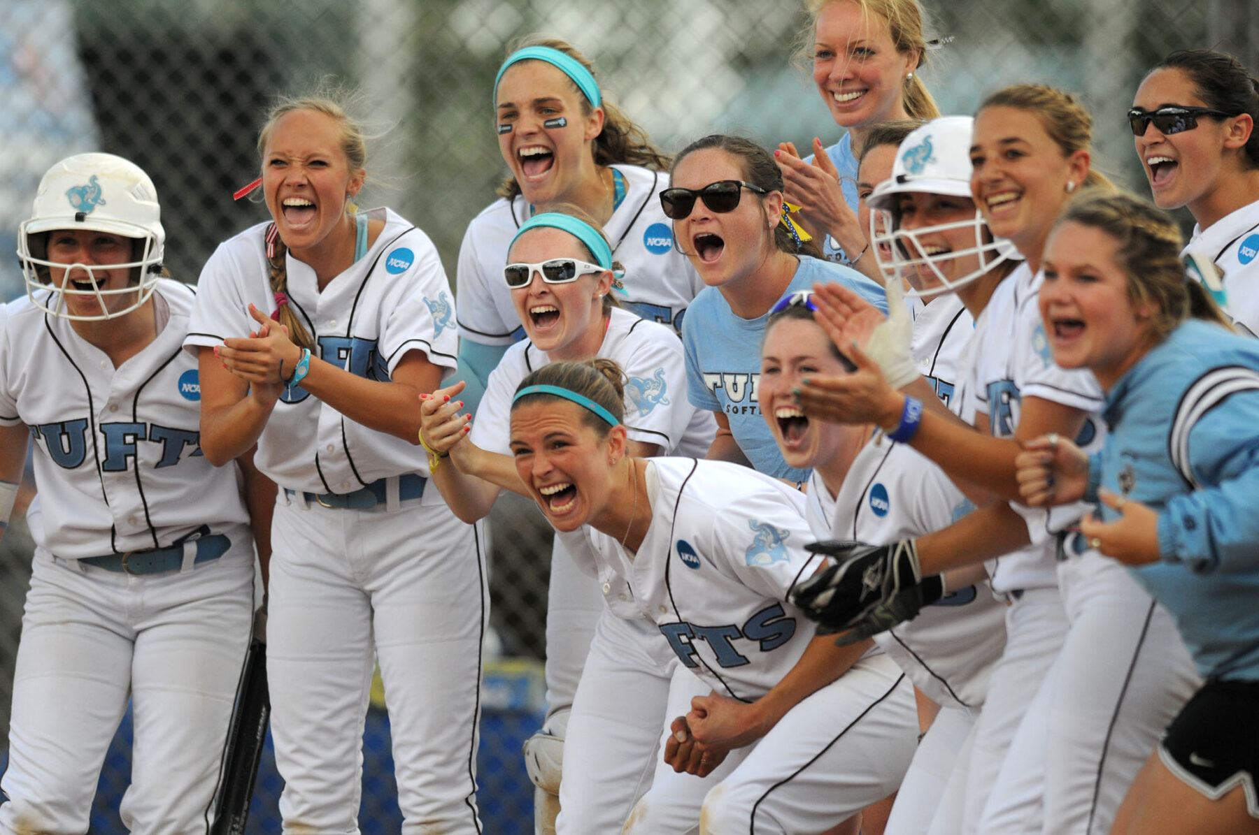 NCAA softball womens softball team cheering teammate home